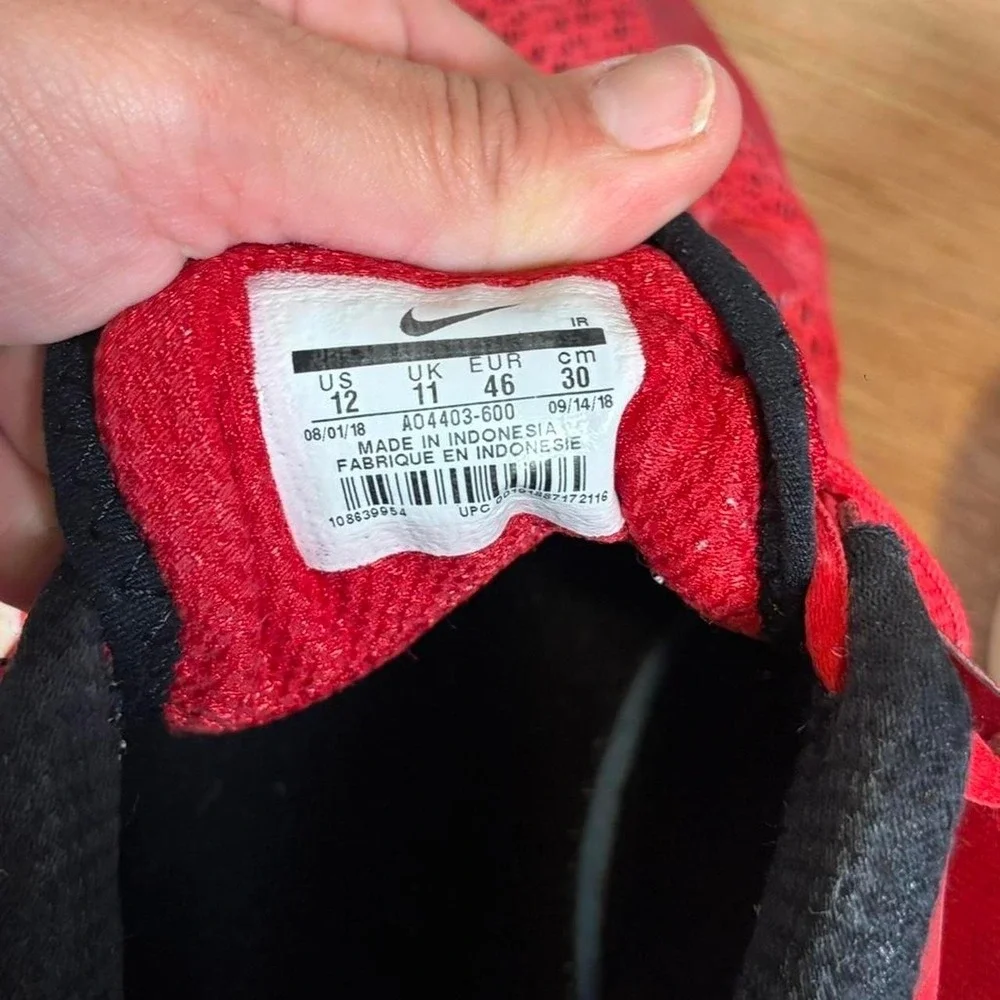 Red sneakers in US 12 Nike